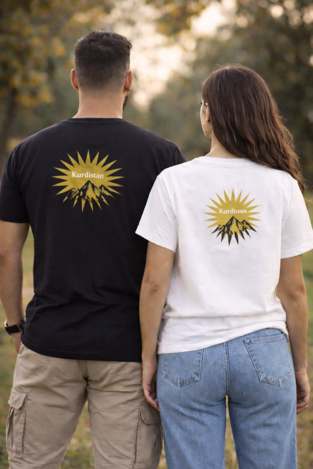 urdistan sunburst and mountain graphic on black t-shirt with gold design